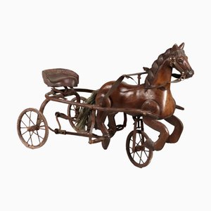 Carrozza in ferro con cavallo in legno di noce