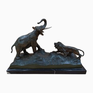 Statuetta antica in bronzo di Elefante e Leone
