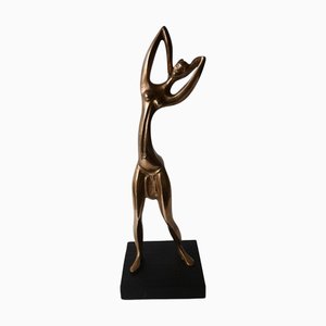 Mid-Century Polished Brass Stylized Africanist Statue in the style of Hagenhauer