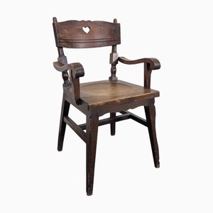 Poltrona brutalista in legno