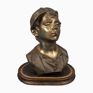 Busto napolitano de escultura Scugnizzo de antimonio bruñido con base de madera, siglo XX