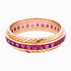 Alliance éternité en or 18 carats et rubis synthétique