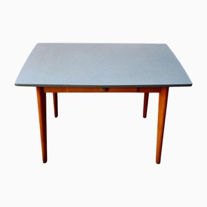 Mesa vintage de formica con patas de compás, años 60