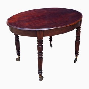 Extendable English Mahogany Table with Casters, England, 1890s