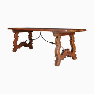 Mesa de refectorio española antigua de estilo barroco con patas talladas y camilla de hierro, década de 1900