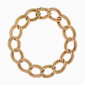 Brazalete de cadena curvada trenzada de oro amarillo de 18 kt, años 60