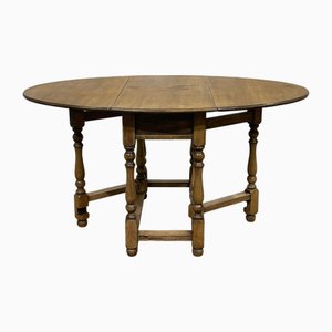 Mesa plegable inglesa Gateleg de roble, años 50