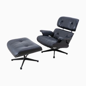 Poltrona con poggiapiedi nr. 670 in pelle di Charles & Ray Eames per Vitra, 2006, set di 2