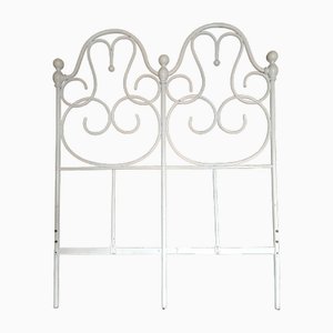 Cama de hierro pintado en blanco, de finales del siglo XIX