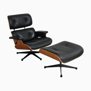 Juego de sillón y otomana de cuero negro de Charles and Ray Eames, años 2000