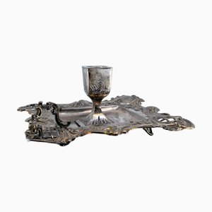 Silbernes Paddel mit geprägten Blumenmotiven