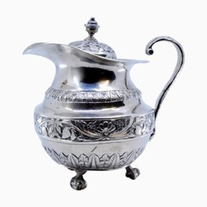 Silver Milk Jug with Chiseled Floral Motifs, Knob Lid and Claw-Shaped Feet
