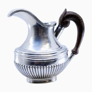 Fluted Silver Water Jug with Wooden Handle and Raised Applications