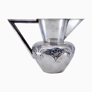 Silver Wine Jug with Raised Plant Motifs and Angular Handle
