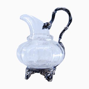 Wasserkrug aus geschliffenem Glas und Silber mit Füßen