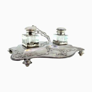 Silver and Glass Inkwell with Floral Reliefs and Feet