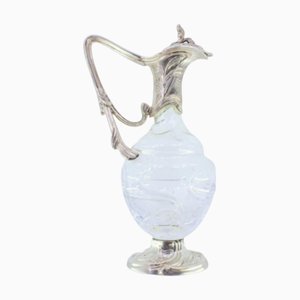 Weinkrug aus Glas mit silbernen Applikationen am Hals und Boden, mit einem Knauf am Klappdeckel