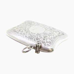 Silver Matchbox with Engraved Floral Motifs, Featuring a Monogram Card and Hanging Ring