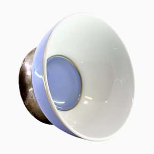 Coppa in porcellana con base circolare in argento dorato