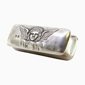 Silberne Box mit Deckel mit Engelsprägung und lila Samt-Innenausstattung