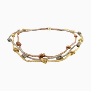 Halskette aus dreifarbigem Gold mit Knoten und eingelegten Chips