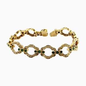 Bracelet en or avec diamants taille brillant et émeraudes incrustées