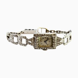 Uhr aus Platin mit Diamanten im Brillantschliff und Armband mit ineinandergreifenden Gliedern