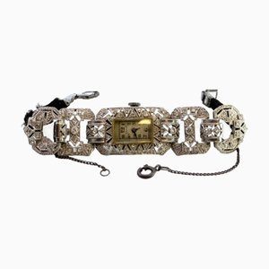 Montre en Platine avec Bracelet Articulé, Diamants Taille Brillant et Chaîne de Sécurité
