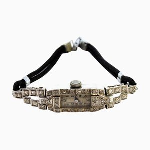 Uhr aus Platin mit Diamanten im Brillantschliff und Armband mit Cordonèe