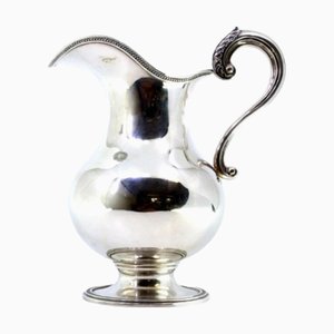 Abgerundeter Wasserkrug in Silber mit rundem Perlmutt- und Muschelboden