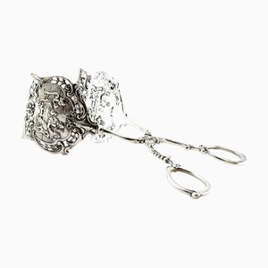 Silver Tongs with Raised Cutouts Shells and Pearly Stems
