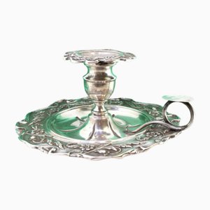 Silbernes Paddel mit enthüllten Blumenmotiven