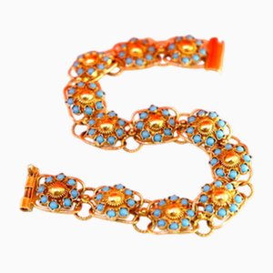 Goldenes Armband mit rosenförmigen Türkisen und gegliederten Gliedern