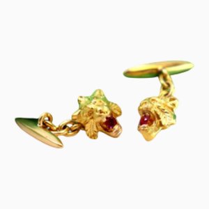 Goldene Manschettenknöpfe mit Löwenkopf und synthetischen roten Steinen, 2 . Set