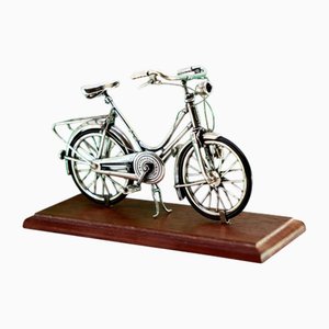 Silver Bicycle with Applications and Wooden Base