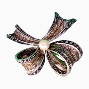 Gold and Silver Bow-Shaped Brooch with Diamond Flakes