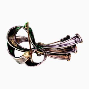 Gold and Silver Bow-Shaped Brooch with Diamond Reliefs and Chips