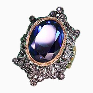 Ring aus Gold und Silber mit Diamantsplittern und synthetischem Saphirschliff