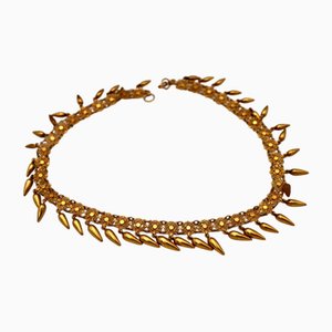 Collar de oro con encaje y colgantes articulados