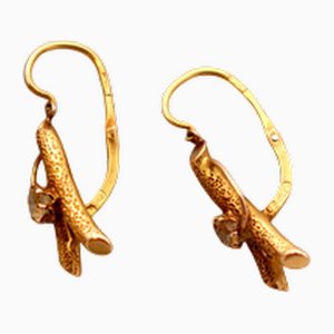 Goldene Ohrringe mit Reliefs und Steinimitationen, 2 . Set