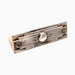 Soporte para palillos de plata con motivos florales en relieve