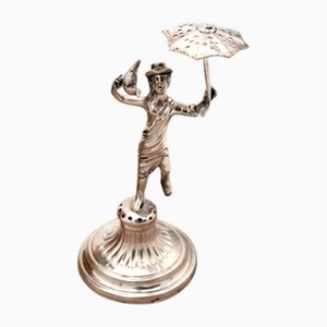 Soporte para palillos de plata con vendedora en pedestal