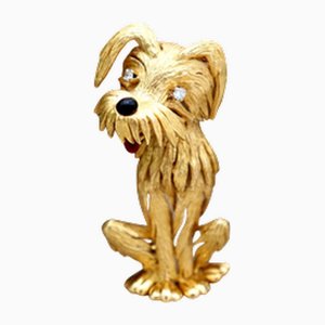 Goldene Brosche in Hundeform