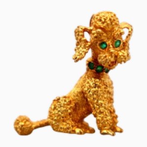 Goldene Brosche in Hundeform