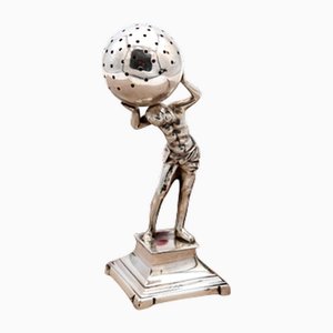 Soporte para palillos de plata con figura de Atlas