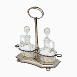 Juego de vinagrera de plata y vidrio. Juego de 3