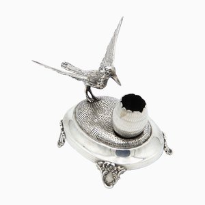 Soporte para palillos de plata con pájaro
