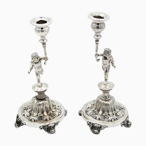 Candlesticks in Embossed Silver with Cherub Figures, Set of 2