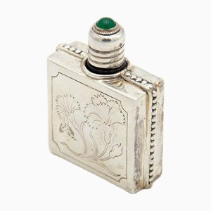 Silberne Parfümflasche mit Blumenmotiven