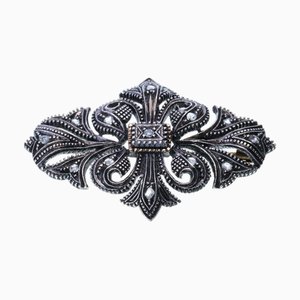 Broche de plata y oro